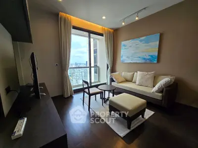 Modern living room with city view, featuring elegant decor and natural light.