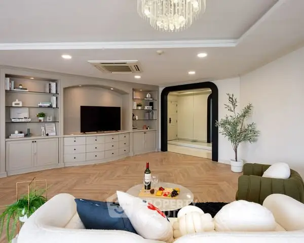 Spacious living room with elegant decor and modern lighting
