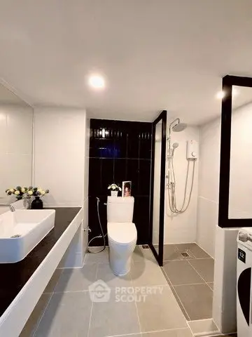 Modern bathroom with sleek fixtures and spacious shower area