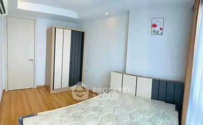 Modern bedroom with minimalist design and wooden flooring