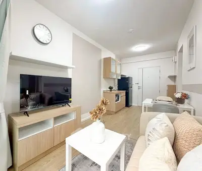 Modern living room with stylish decor and open kitchen layout