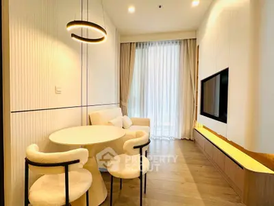 Modern living room with stylish furniture and large window for natural light
