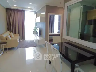 Modern open-plan living room with dining area and natural light
