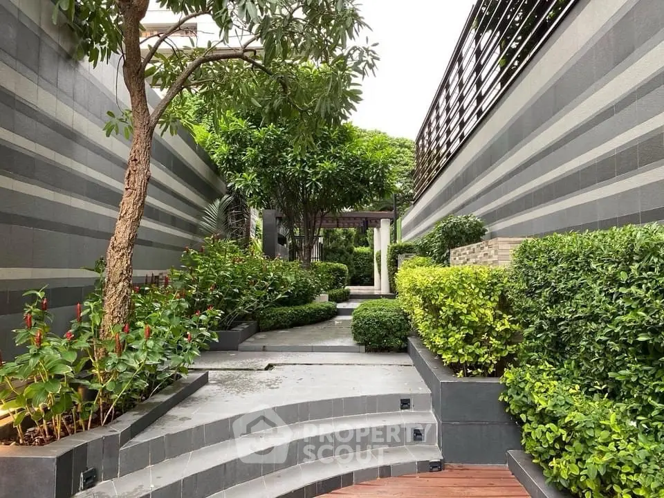 Luxurious garden pathway with lush greenery and modern design elements.