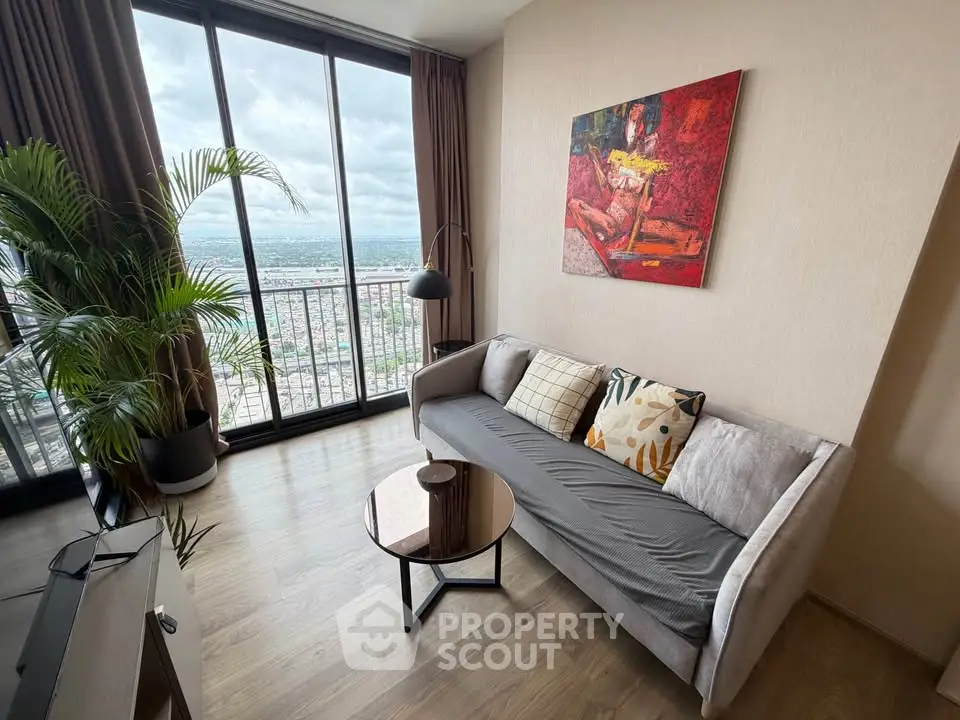 Modern living room with floor-to-ceiling windows and stunning city view