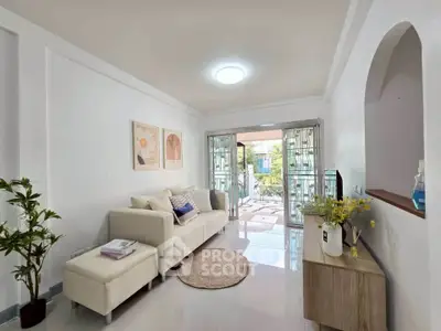 Bright and airy living room with modern decor and garden view, perfect for relaxation and entertaining.