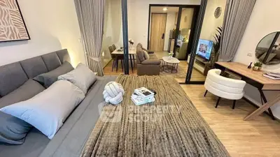 Modern studio apartment with cozy bedroom and stylish living area