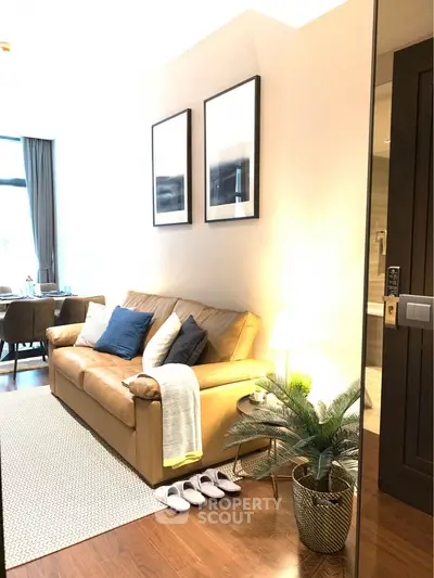Stylish living room with cozy leather sofa and elegant decor in modern apartment