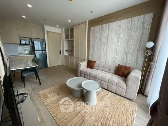 Modern living room with stylish decor and open kitchen layout