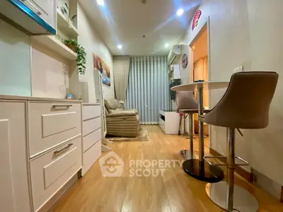 Modern living room with stylish furniture and open layout, featuring a cozy seating area and dining space.