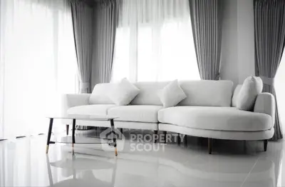 Elegant modern living room with stylish white sofa and chic curtains