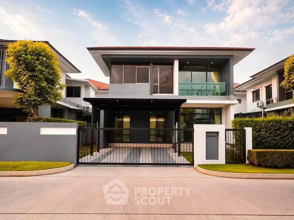 Modern two-story house with sleek design and spacious driveway in a serene neighborhood.