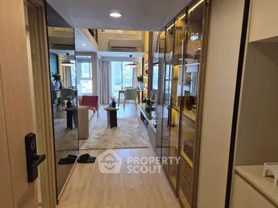 Modern living room with mirrored walls and stylish decor