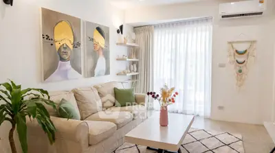 Stylish living room with modern decor, cozy sofa, and natural light