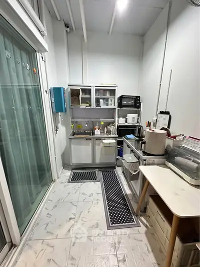 Compact kitchen with modern appliances and storage solutions