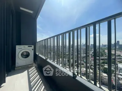 Spacious balcony with city view and washing machine, perfect for urban living.
