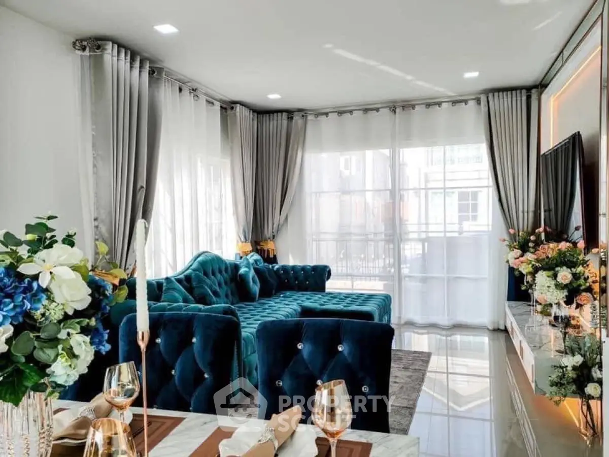 Luxurious living room with plush blue sofas and elegant decor