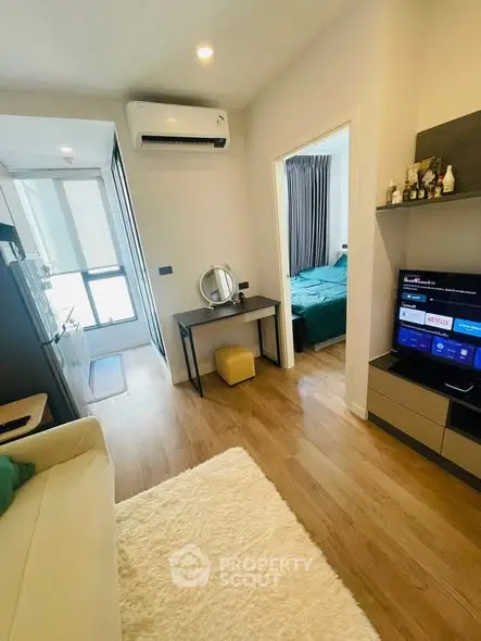 Modern apartment interior with cozy living area and bedroom view