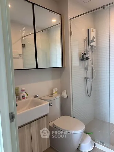 Modern bathroom with glass shower and sleek fixtures