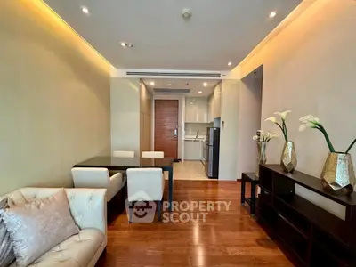 Modern living room with elegant dining area and open kitchen layout