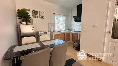 Cozy kitchen with dining area and modern appliances in a stylish home