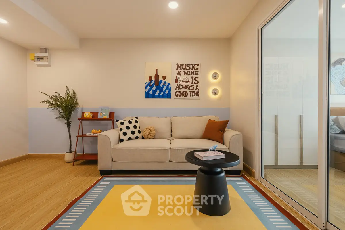 Stylish living room with modern decor and cozy ambiance, perfect for relaxation and entertainment.