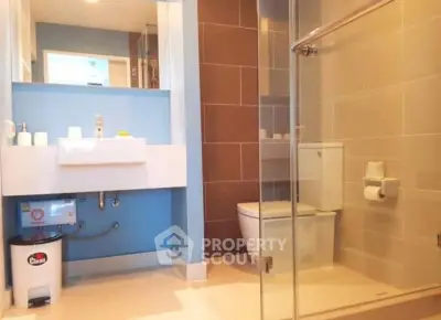 Modern bathroom with sleek design and glass shower enclosure