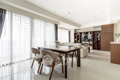 Spacious modern living room with elegant dining area and large windows