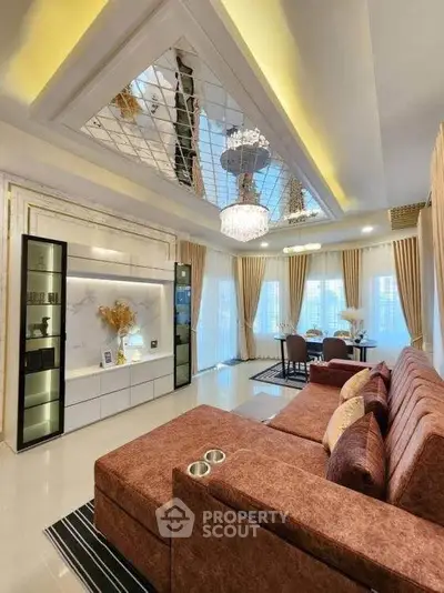 Luxurious living room with elegant chandelier and stylish decor