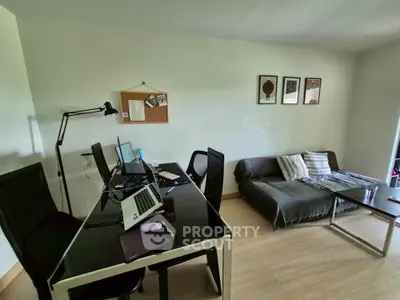 Modern study room with sleek desk, comfortable seating, and stylish decor.