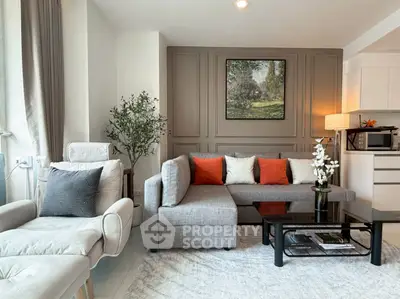 Stylish living room with modern gray sofa, accent pillows, and elegant decor