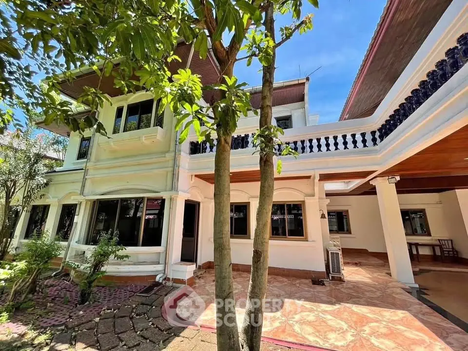 Stunning two-story house with spacious balcony and lush garden, perfect for family living.