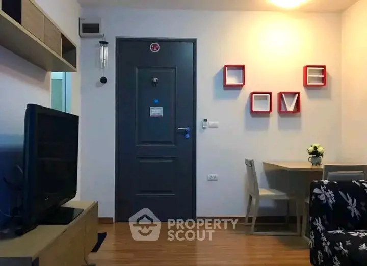 Charming living room with modern decor and cozy ambiance, perfect for relaxation and entertainment.