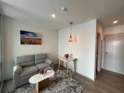 Cozy living room with modern decor and sunflower artwork, perfect for relaxation.