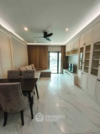 Spacious living room with elegant decor and large windows for natural light.