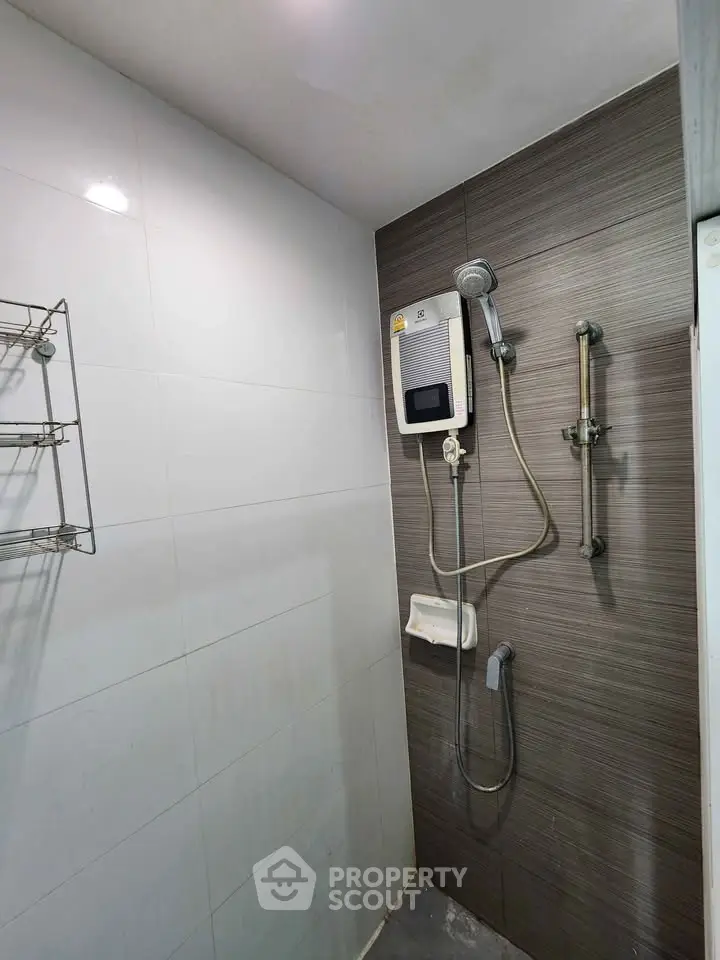 Modern bathroom with shower and water heater in sleek design
