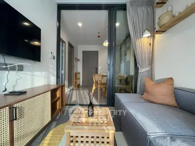 Modern living room with stylish decor and open view to dining area