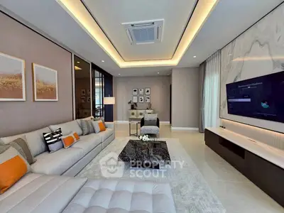 Luxurious modern living room with elegant decor and spacious seating area.