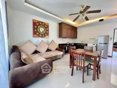Spacious living room with modern kitchen and elegant decor