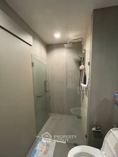Modern bathroom with glass shower enclosure and sleek design