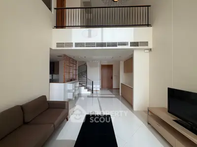 Spacious modern living room with mezzanine and sleek design