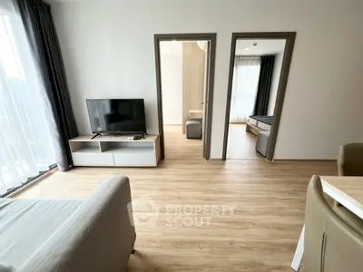 Modern living room with wooden flooring and natural light