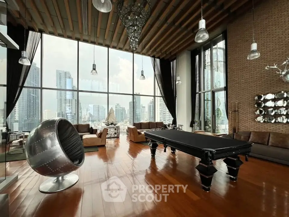 Luxurious penthouse living room with stunning city view and elegant decor.