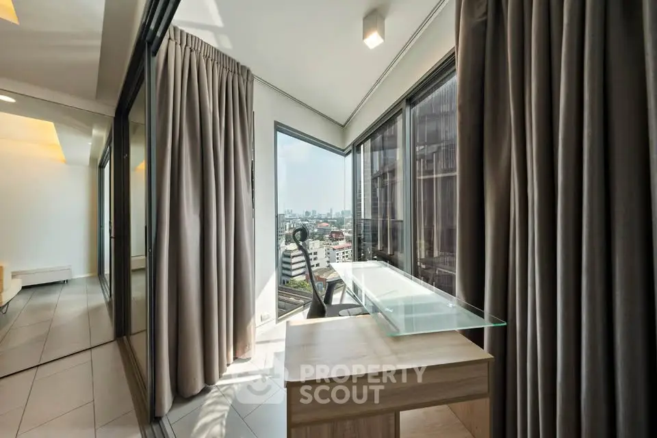 Modern apartment with floor-to-ceiling windows and city view