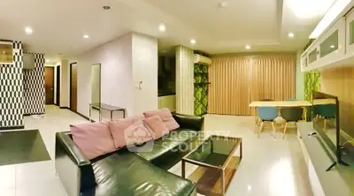 Spacious modern living room with stylish decor and open layout, perfect for entertaining.