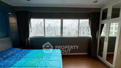 Stunning bedroom with panoramic city view and modern furnishings