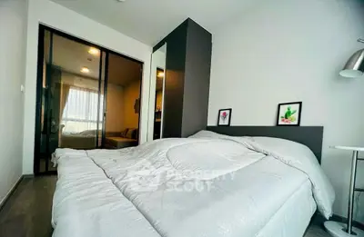 Modern bedroom with cozy bed and stylish decor in a contemporary apartment