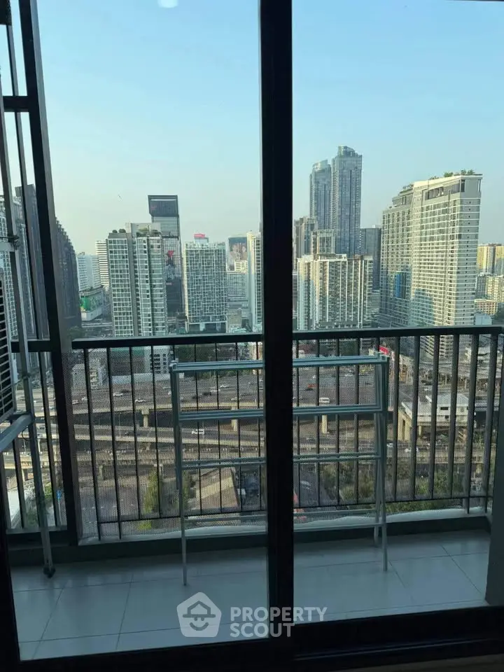 Stunning cityscape view from a high-rise balcony, perfect for urban living enthusiasts.