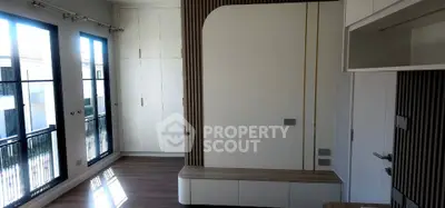 Modern interior with large windows and sleek wooden flooring