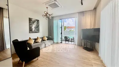 Spacious modern living room with large windows and stylish decor